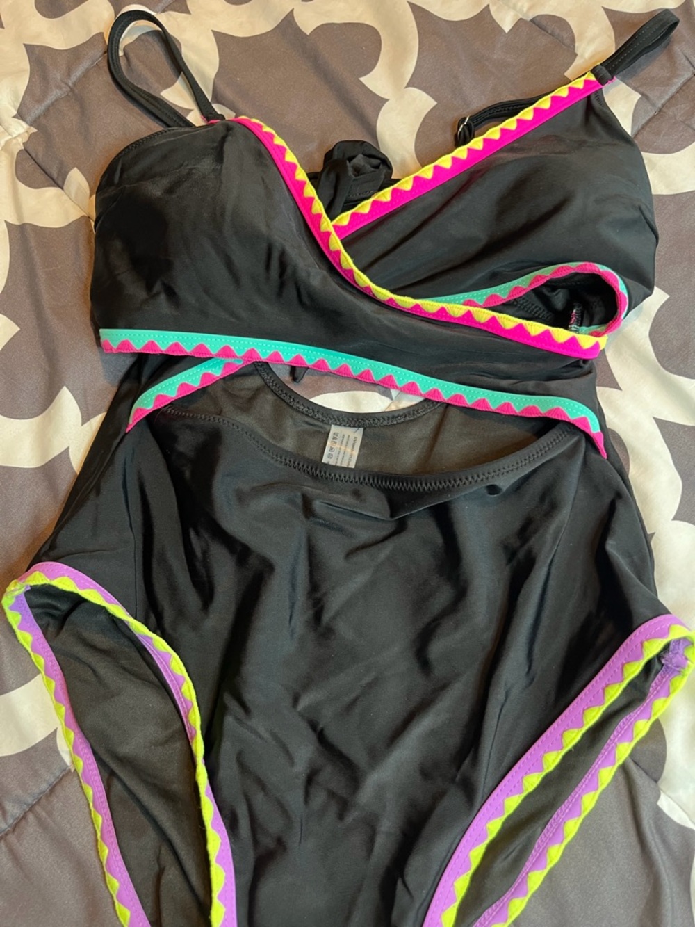 Women’s Black w/Multi Color Accents Open Cut Waist One-
piece Swimsuit size S…
